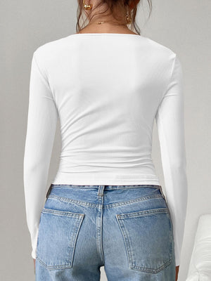 White ribbed long sleeve top with square neckline, shown from the back.