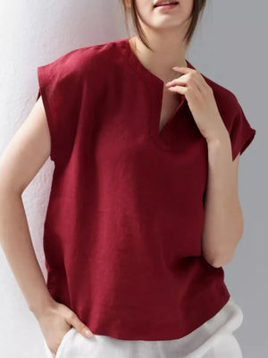 Red cap sleeve shirt with notched neckline, relaxed fit.