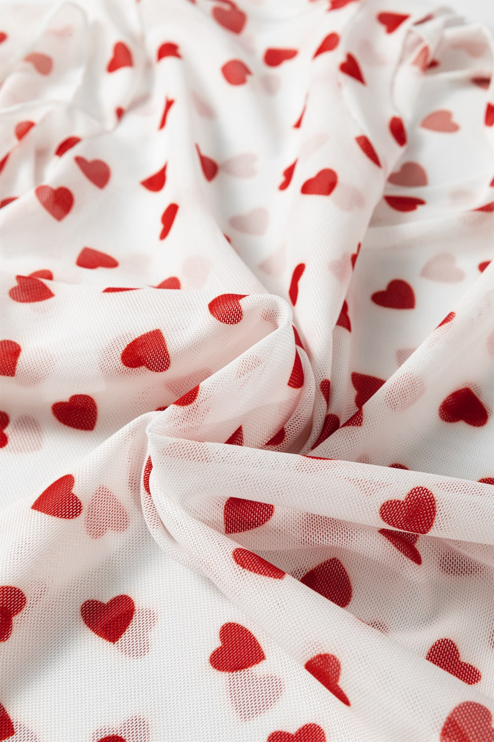 Sheer white t-shirt with red heart print, mesh fabric detail