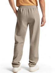 Khaki textured drawstring sweatpants for men with elastic waistband and pockets.