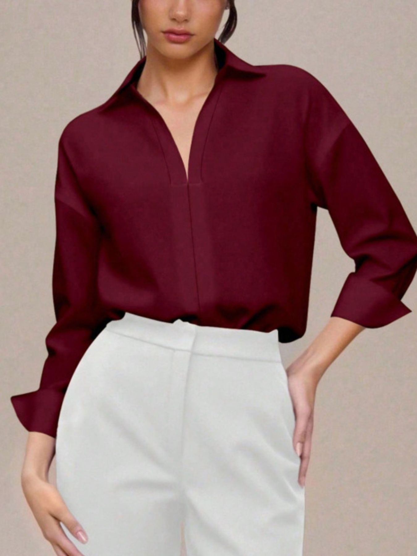 Classic collared long sleeve bodysuit in wine red with a deep V-neck detail.