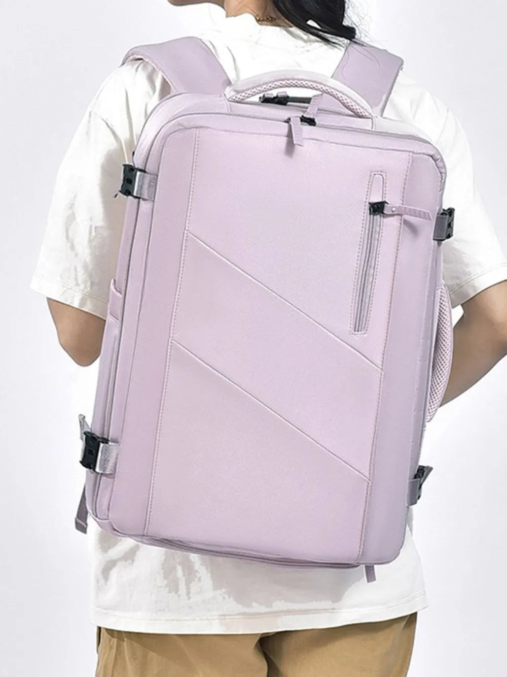 Lilac structured backpack with zippered shoe compartment and adjustable straps.