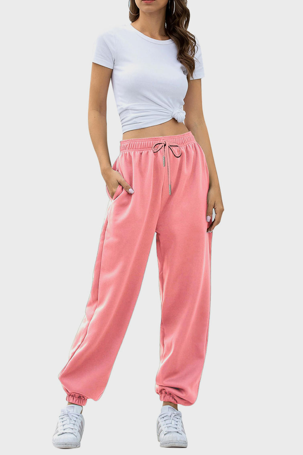 Dusty pink sweatpants with gathered cuffs and drawstring waist.