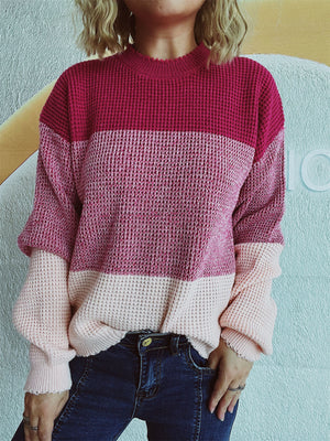 Colorblock textured knit pullover sweater with mock neck and long sleeves in pink and maroon.