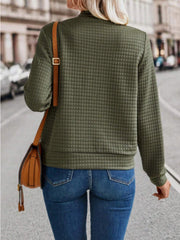 Army green quilted bomber jacket with zip closure, long sleeves, and crew neck.