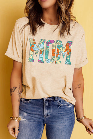 Light apricot floral mom graphic tee with rolled sleeves.