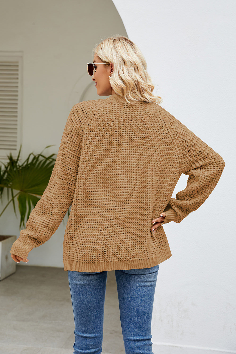 Caramel waffle knit raglan pocket cardigan with long sleeves and a relaxed fit.
