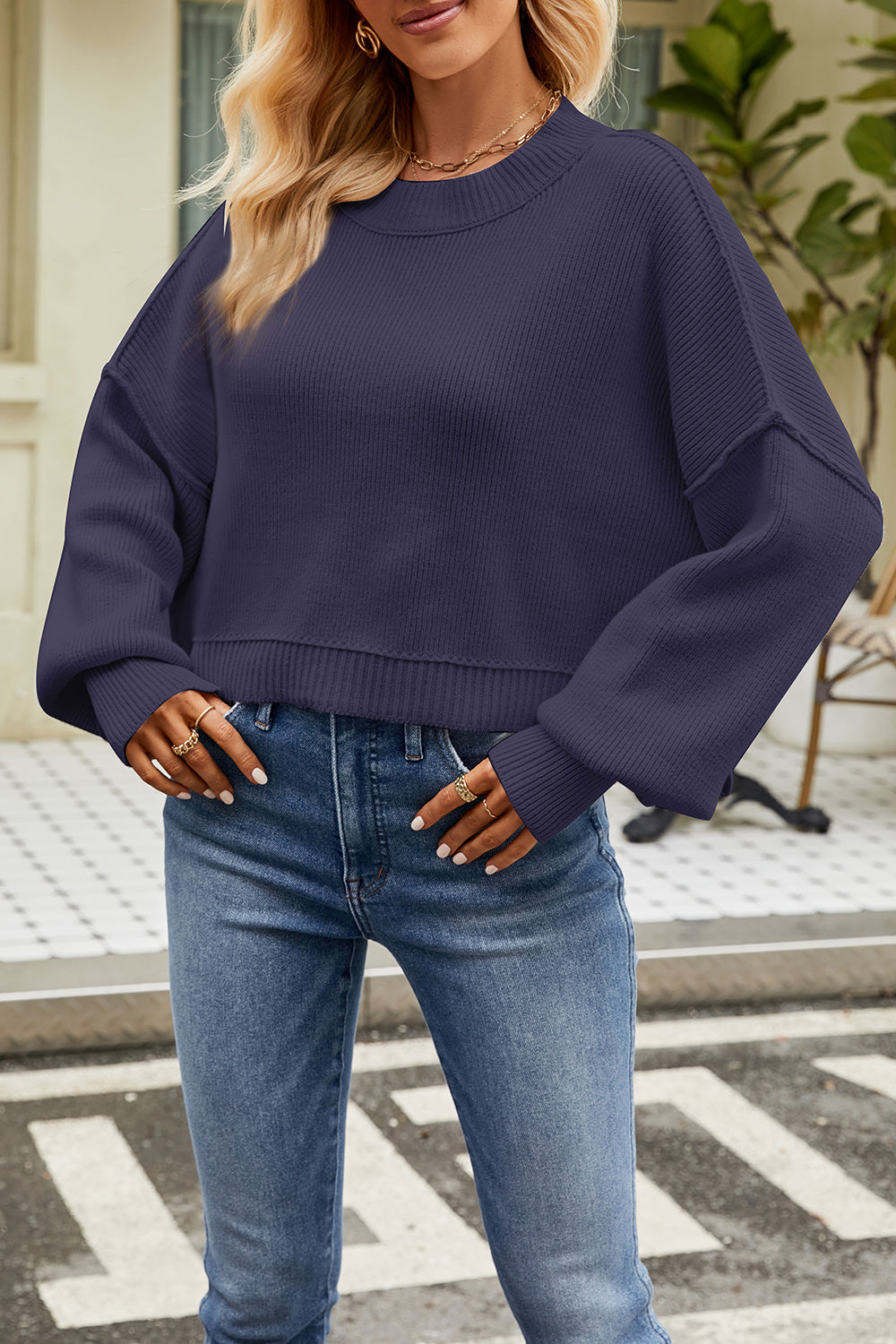 Boxy ribbed knit sweater in dark blue with crew neck and dropped shoulders.