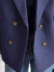 Navy double-breasted wool blend blazer with button detail and lapel collar.