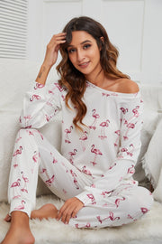 White flamingo print off-shoulder lounge set with long sleeves and pants.