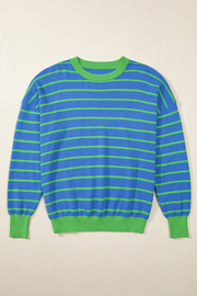 Blue waffle knit sweater with green stripes and contrasting green crew neck, cuffs, and hem.