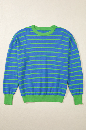 Blue waffle knit sweater with green stripes and contrasting green crew neck, cuffs, and hem.