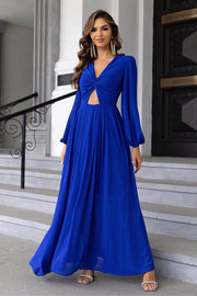 Royal blue maxi dress with twisted bodice cutout and long balloon sleeves.