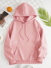 Oversized blush pink hoodie with pouch pocket and drawstring hood.