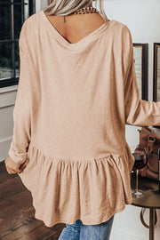Peplum button-down V-neck top in Dust Storm cotton with ruffled hem.