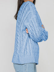 Sky blue acrylic cable knit openwork sweater with crew neck and long sleeves.