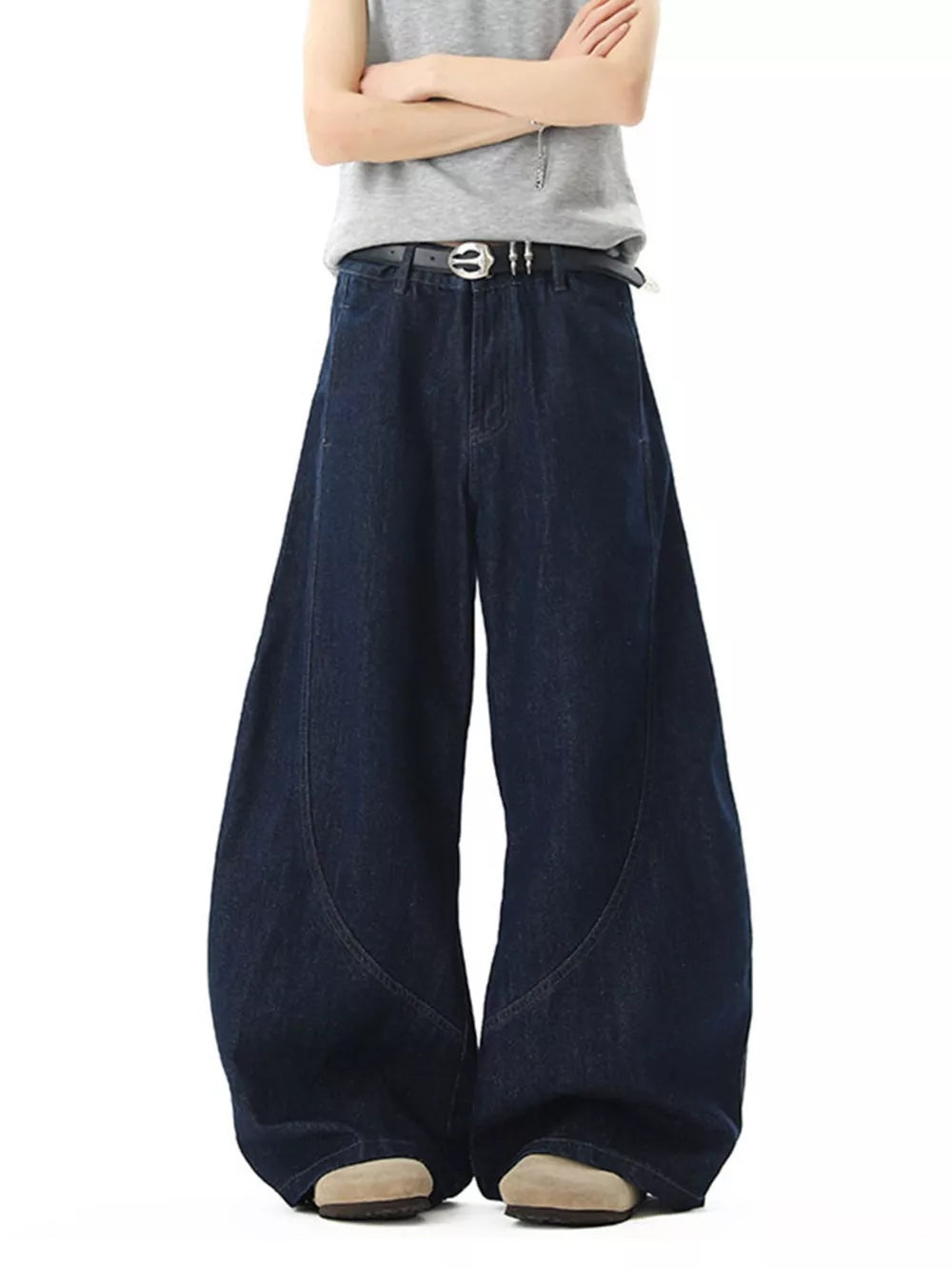 Men's dark wash cotton wide-leg jeans with pockets and curved seam detail.