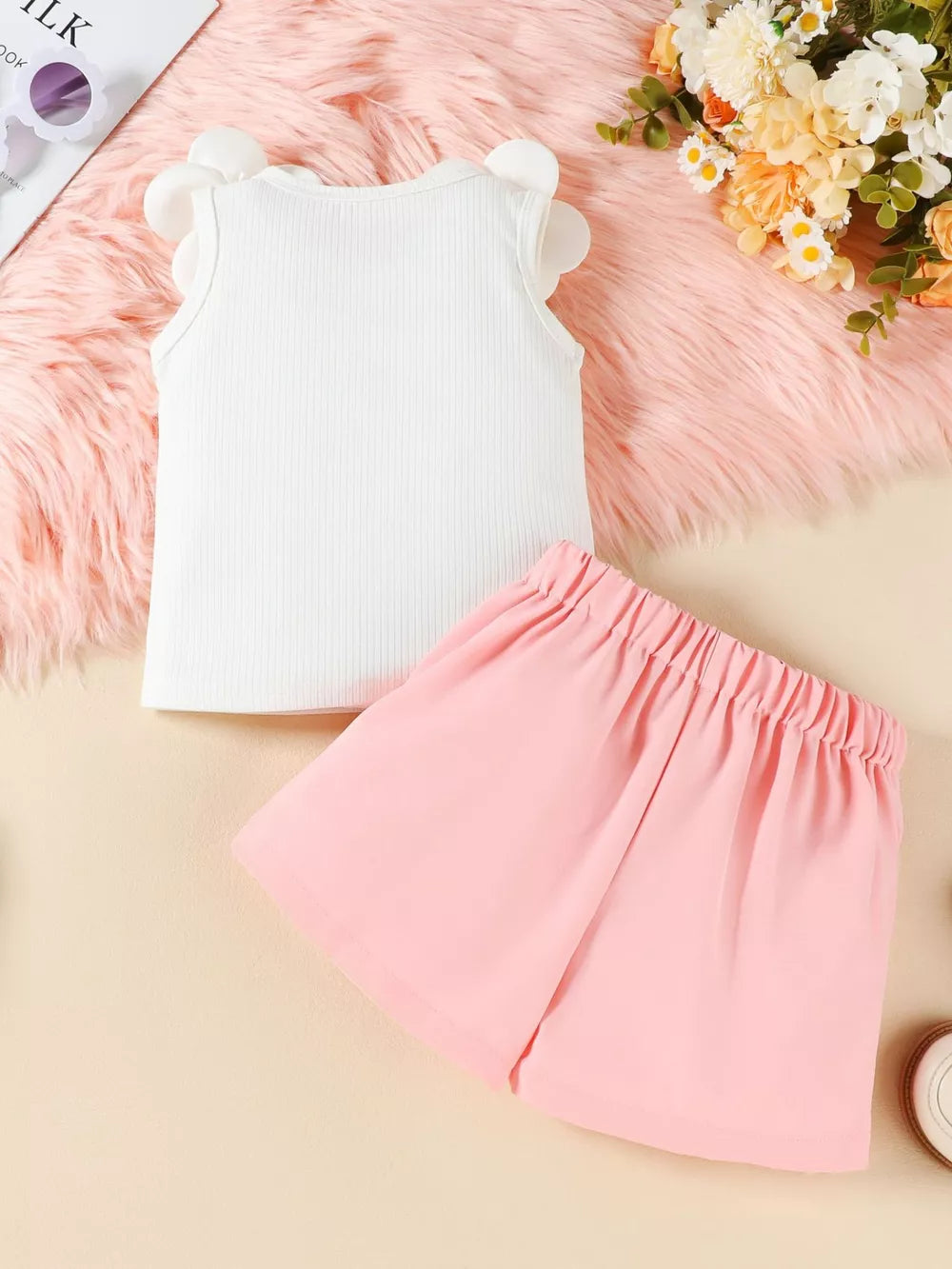 Baby girl white ribbed tank top with floral applique sleeves and pink bow skort.
