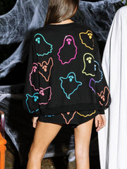 Black loungewear set with colorful ghost appliqués on sweatshirt and shorts.