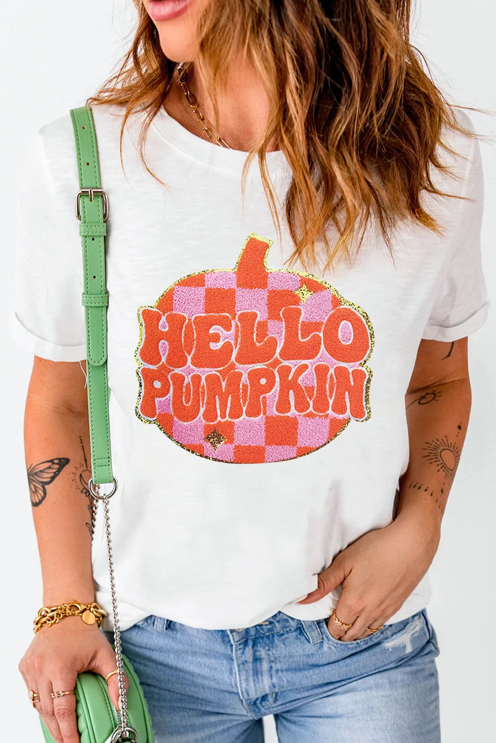 White graphic tee with "Hello Pumpkin" text on a checkered pumpkin, short sleeves, crew neck
