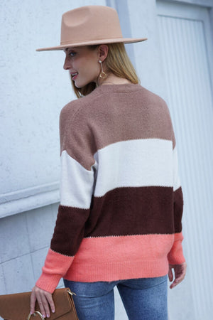 Colorblock acrylic cardigan with brown, white, and coral stripes.