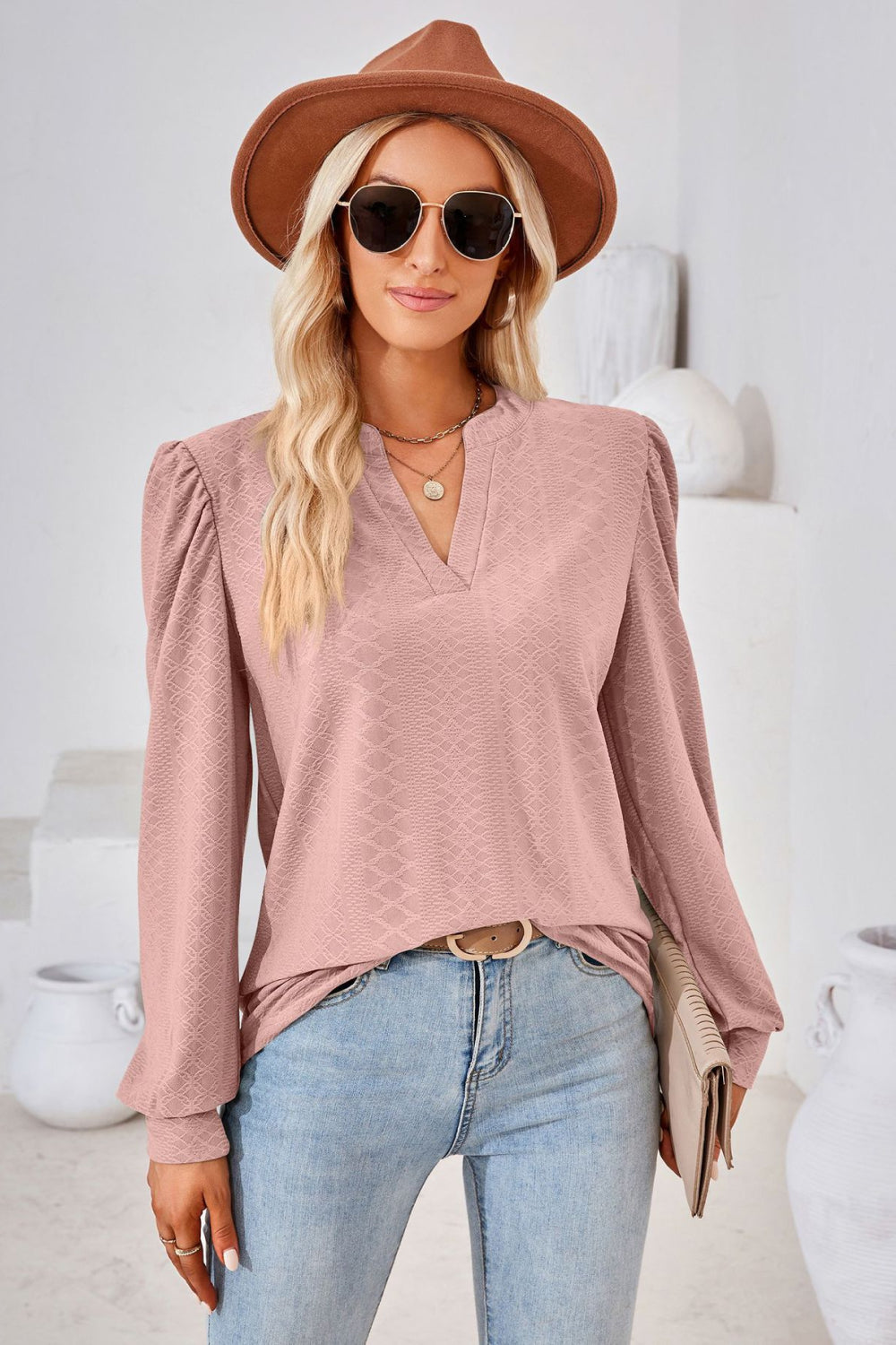Pink textured blouse with bishop sleeves and v-neck