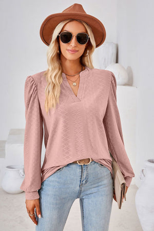 Pink textured blouse with bishop sleeves and v-neck