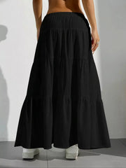 Black tiered maxi skirt with elastic waistband and textured fabric.
