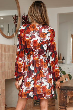 Floral wrap mini dress with puff sleeves in autumn floral print.