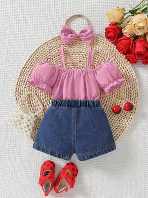 Pink ruffle off-shoulder top and denim shorts set with matching bow headband.