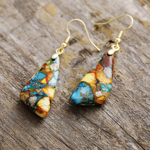 Multicolor stone drop earrings with gold hooks, featuring blue, yellow, and brown mosaic patterns.