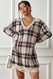 Plaid knit mini dress with distressed hem and V-neck.