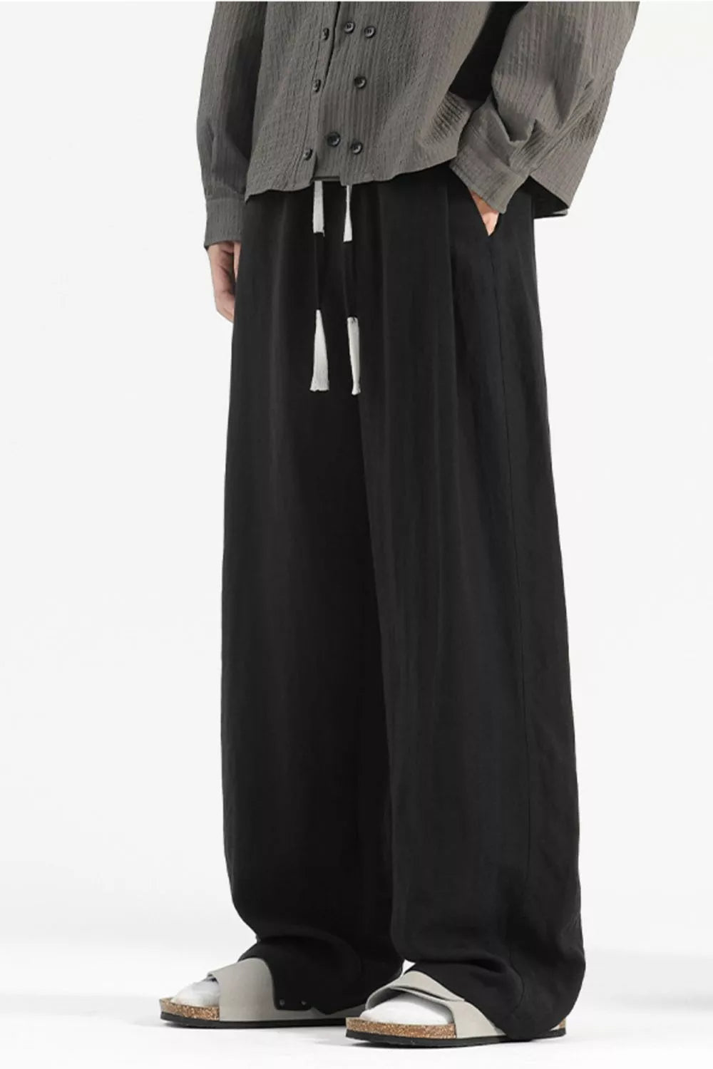 Black wide-leg lounge sweatpants with drawstring and pockets.