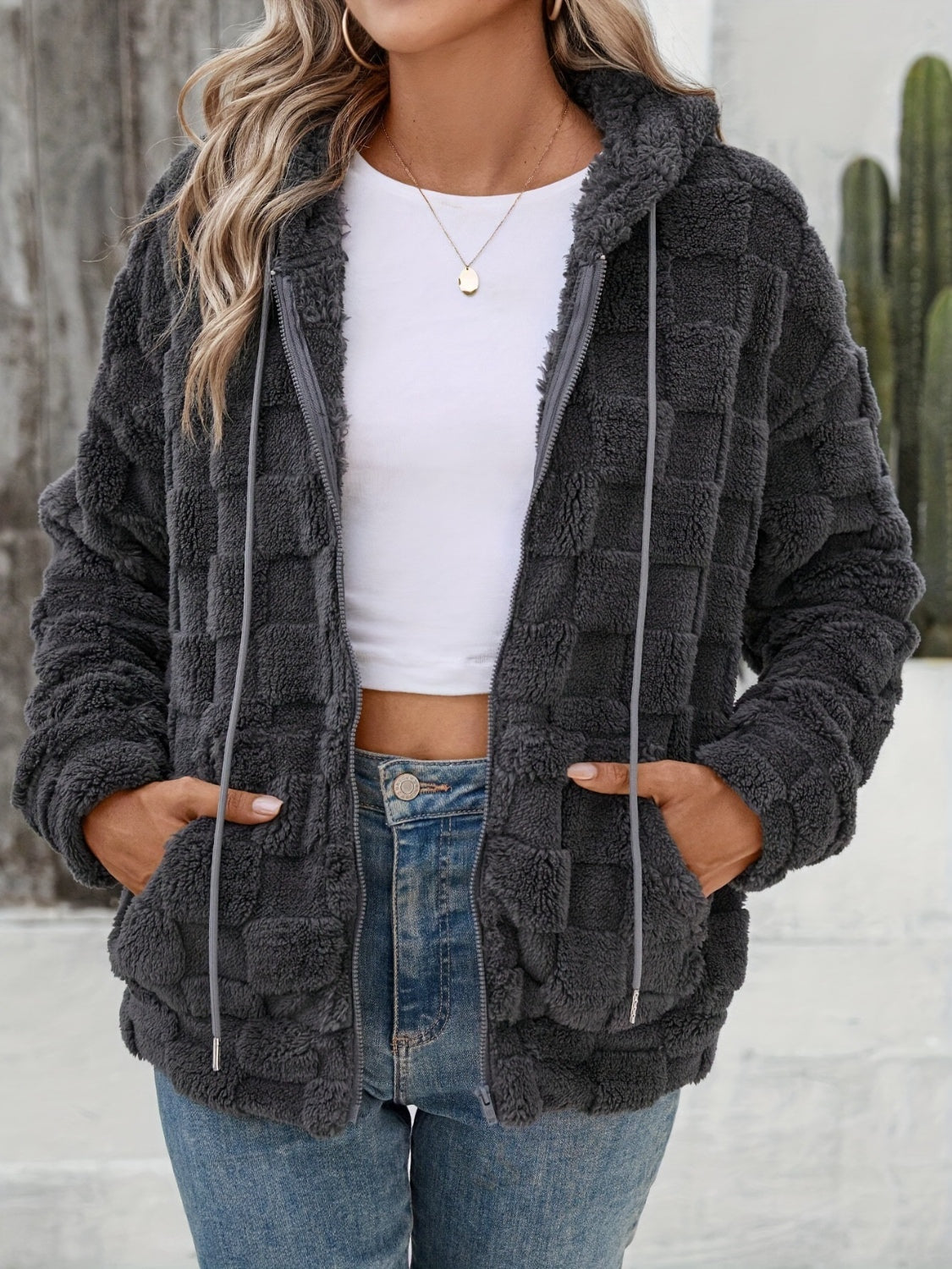 Dark gray textured grid fleece hoodie jacket with adjustable hood and zipper closure.