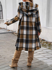 Brown plaid hooded duster coat with buttoned front and A-line cut.