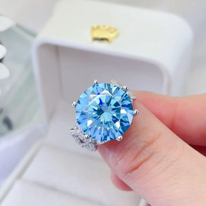Celestial blue moissanite knot ring with sparkling accents.