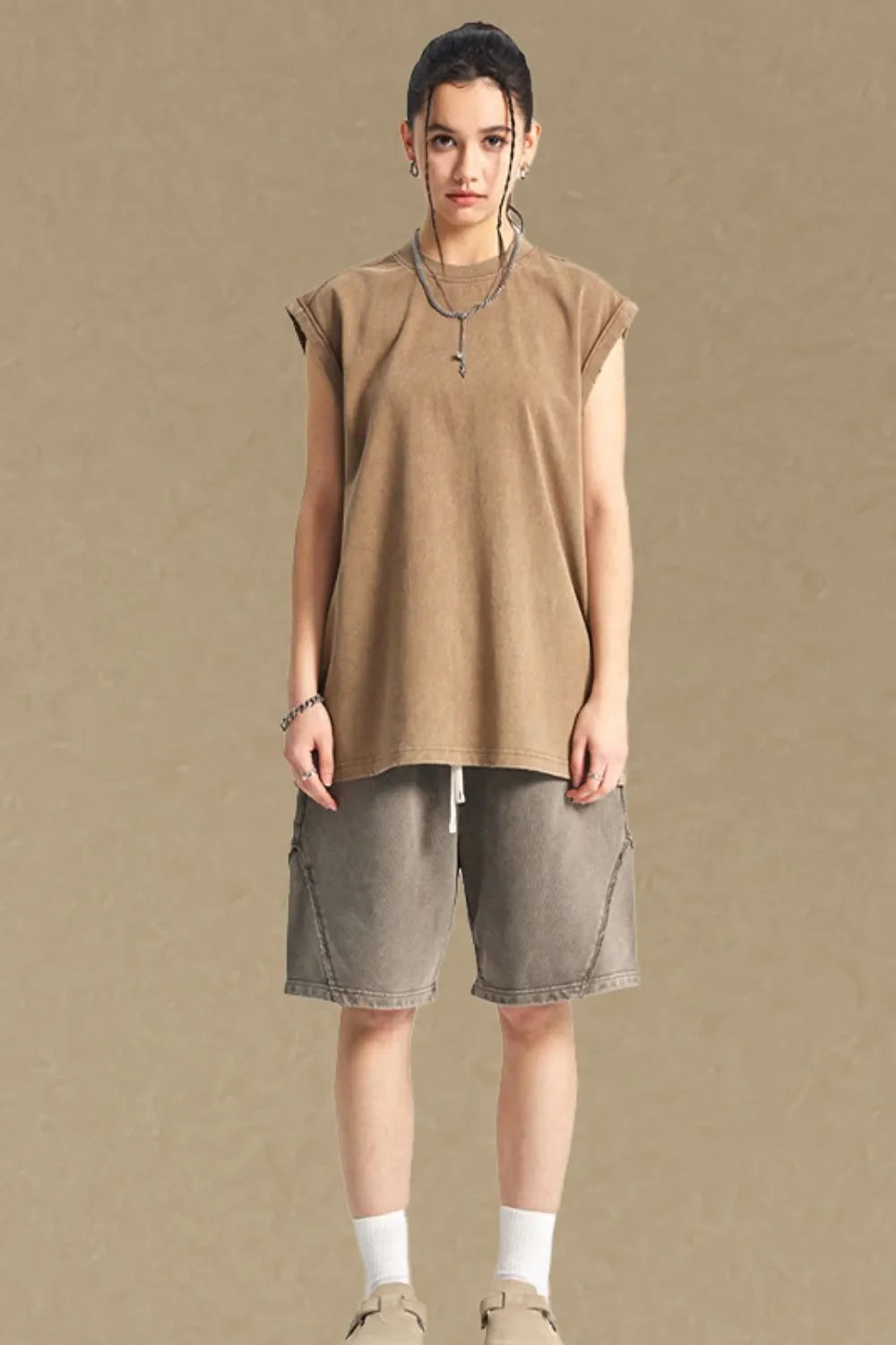 Washed cotton muscle tee in tan, relaxed fit, sleeveless, crew neck.