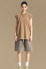 Washed cotton muscle tee in tan, relaxed fit, sleeveless, crew neck.