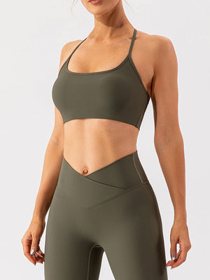 Ribbed halterneck active bra in Matcha Green with thin straps and a scoop neckline.