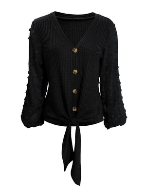 Black waffle knit tie front blouse with Swiss dot sleeves and button front.