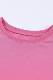 Rose pink crewneck sweatshirt with ribbed neckline and cuffs.