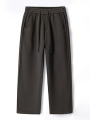 Men's dark gray relaxed fit sweatpants with drawstring and side seam detail.