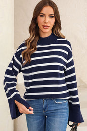 Navy and white striped knit sweater with mock neck and bell sleeves.