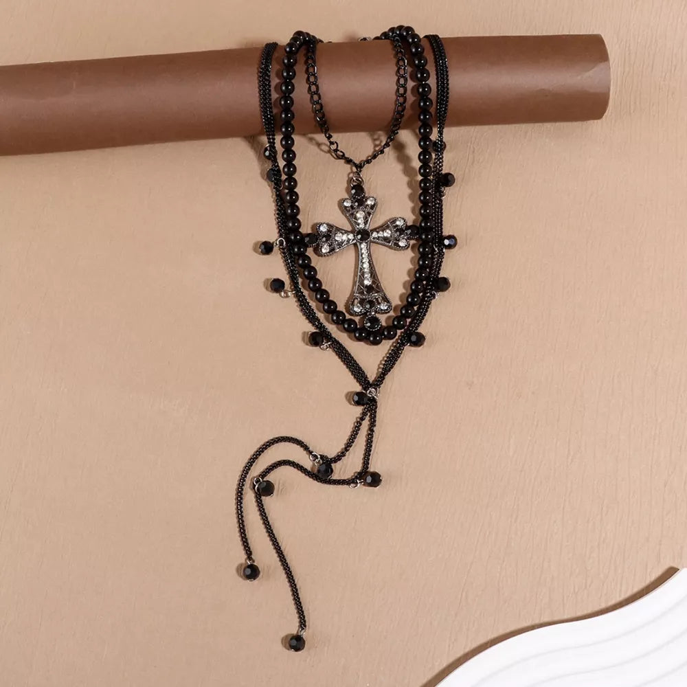 Black layered cross pendant necklace set with pearl and crystal accents