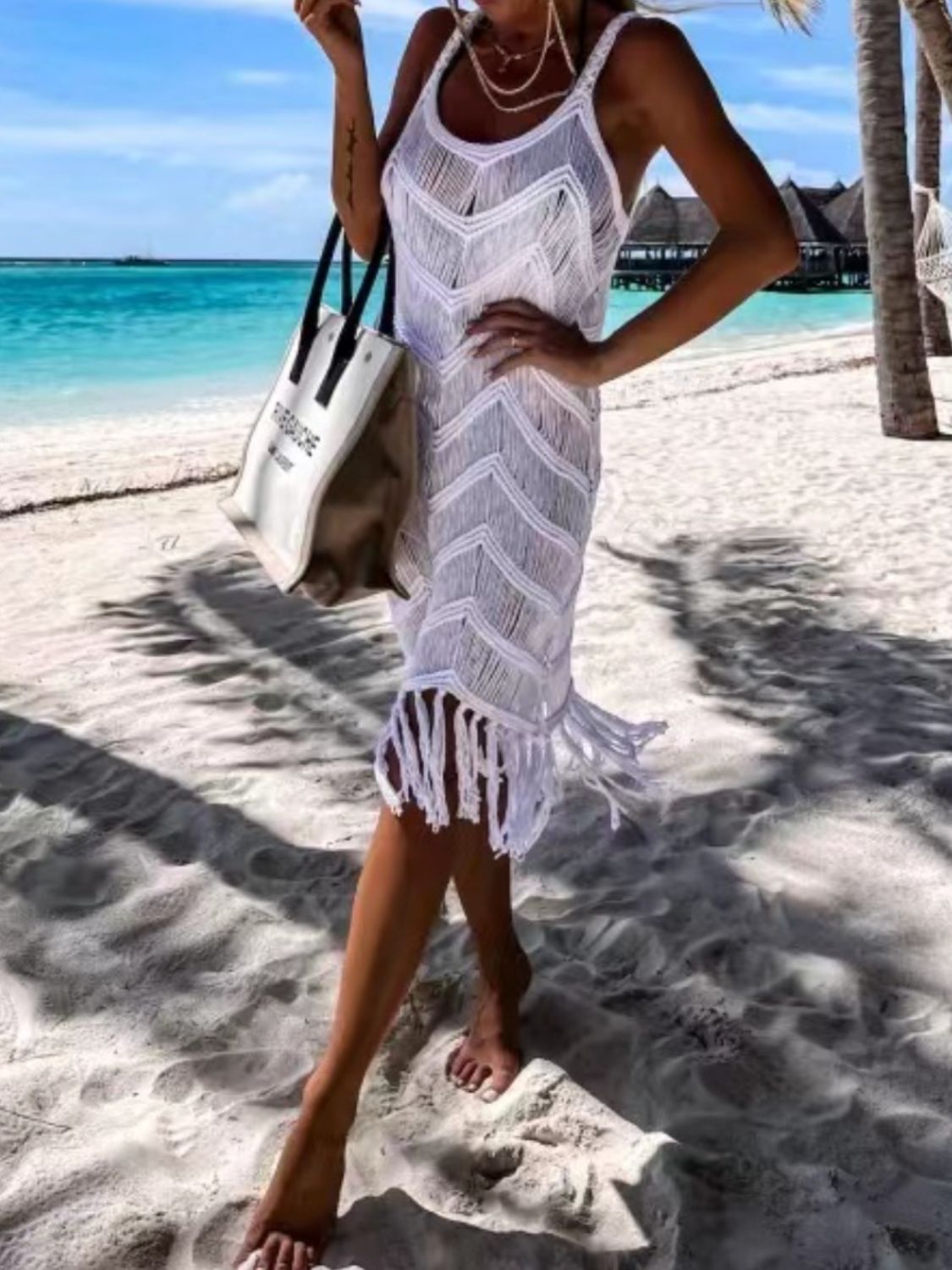 White macramé chevron cover-up dress with fringe hem and spaghetti straps.