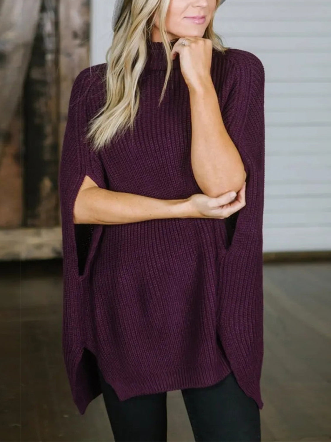 Deep Purple turtleneck knit sweater with cape sleeves and ribbed texture.