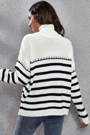Turtleneck sweater with black and white Breton stripes, acrylic knit, long sleeves, and a relaxed fit.