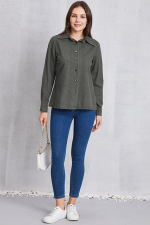 Washed dark gray denim shirt with pointed collar and button front, styled with blue skinny jeans.