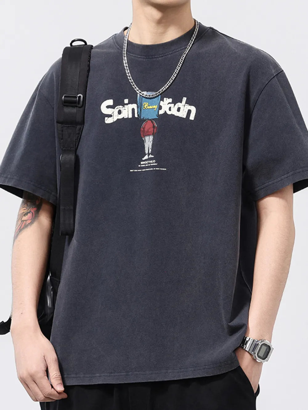 Men's graphic print relaxed fit t-shirt in dark gray cotton with a cartoon design.