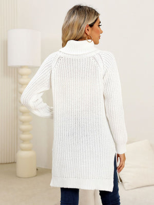 White ribbed knit turtleneck tunic with side slits.